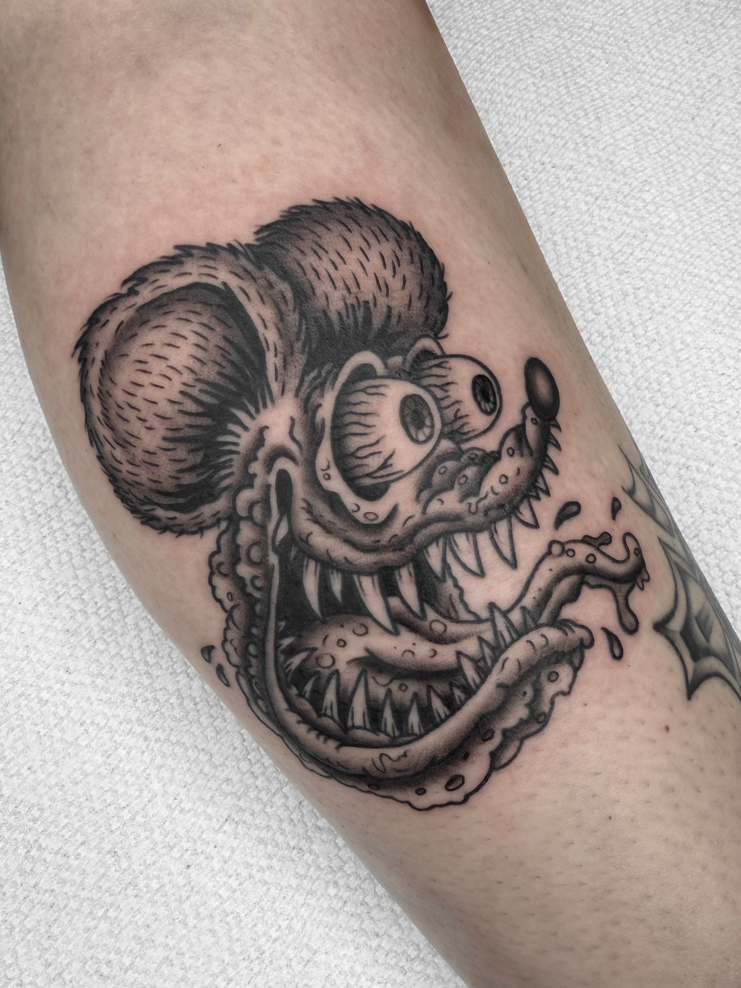 Black and grey Rat Fink tattoo by Matt Maldonado